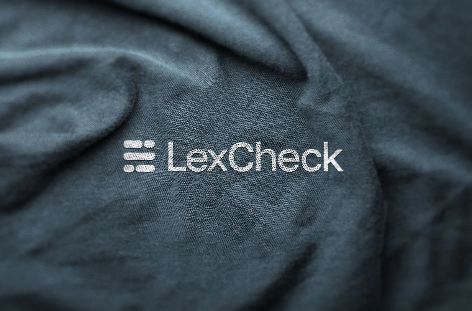 LexCheck logo embossed on dark teal fabric.