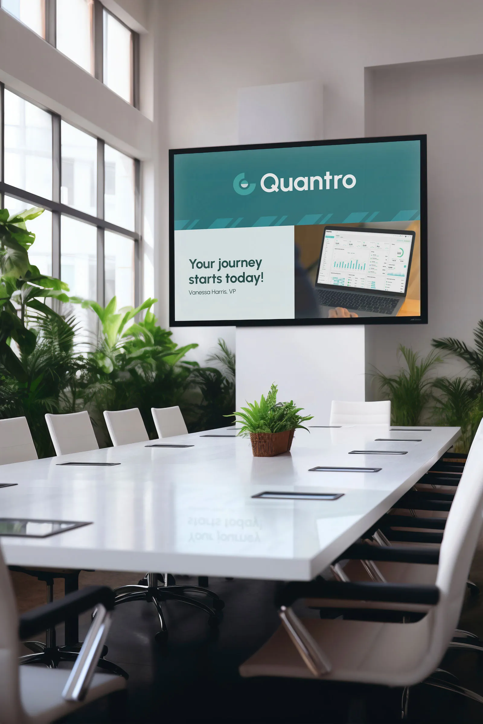 Wall screen in a bright meeting room showing a Quantro slide: "Your journey starts today!".