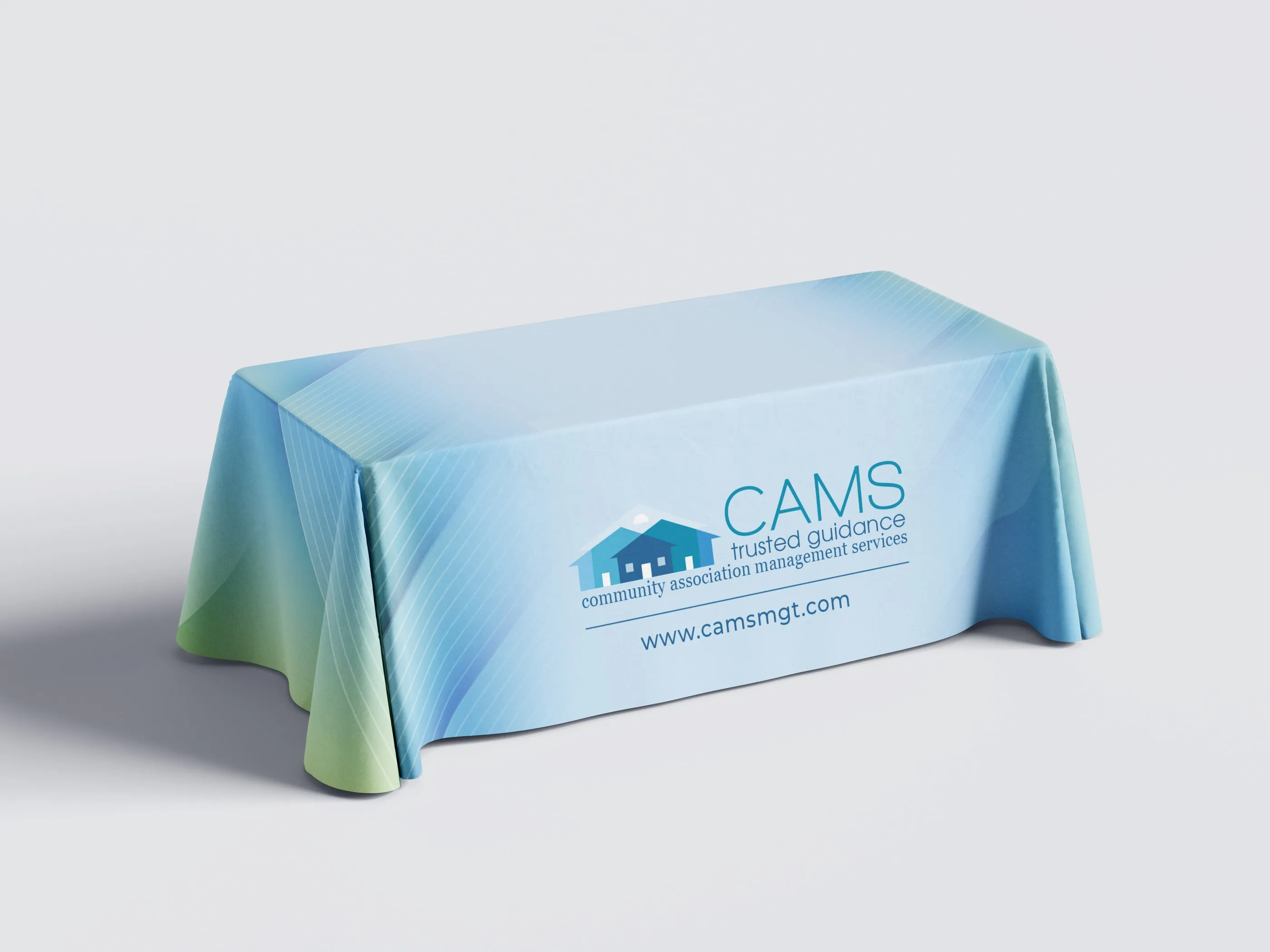 CAMS table cover in light blue with the CAMS logo and website.