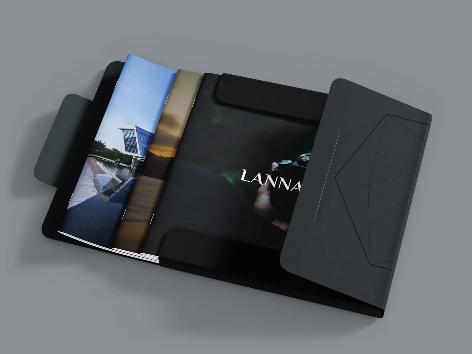Black Lannah presentation folder holding printed photographs.