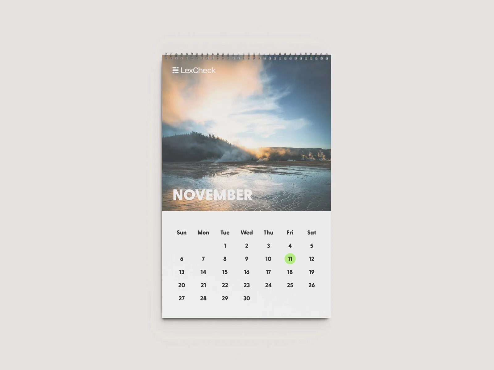 LexCheck wall calendar open to November, with a misty lake photo.