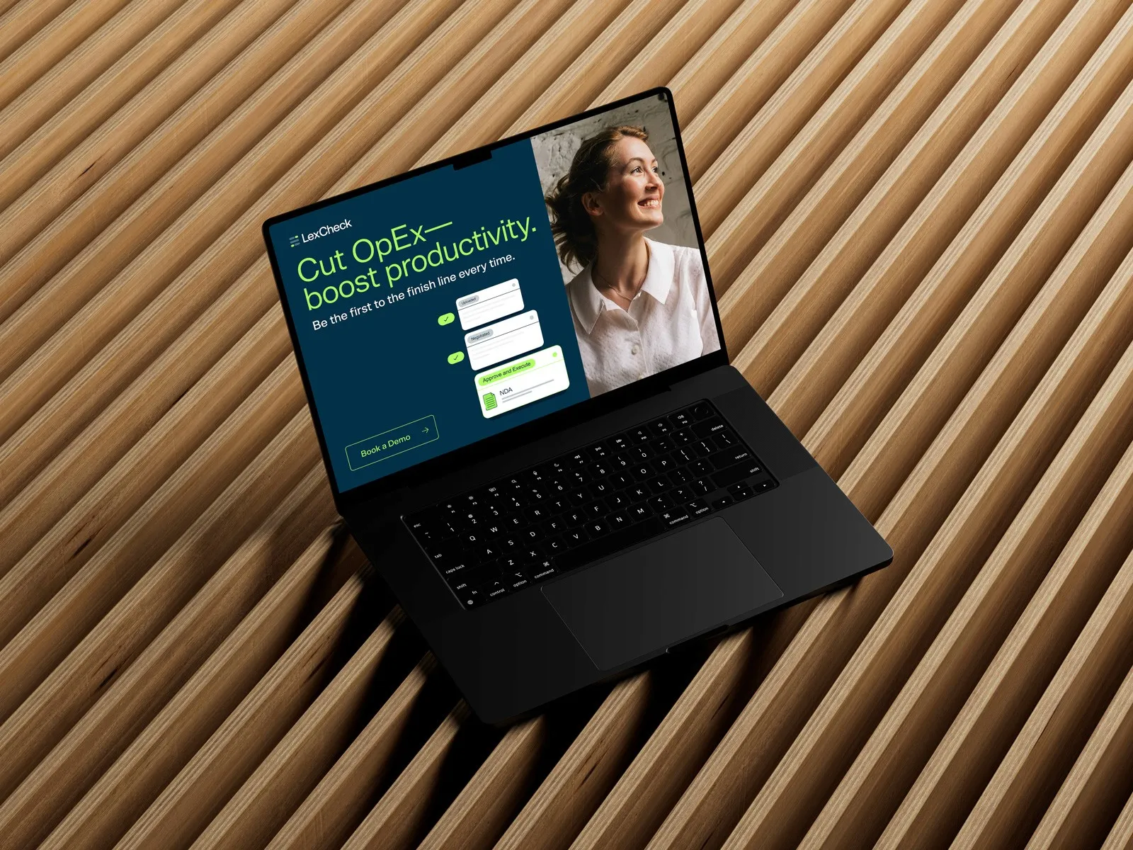 Laptop on a slatted wood surface showing a LexCheck landing page: "Cut OpEx, boost productivity".