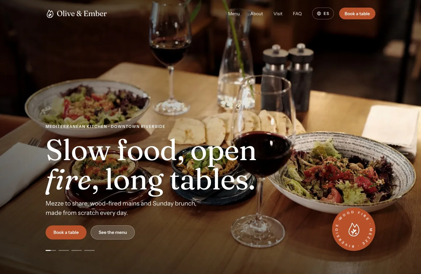 Olive & Ember sample site: a candlelit table of Mediterranean dishes behind the headline “Slow food, open fire, long tables.”