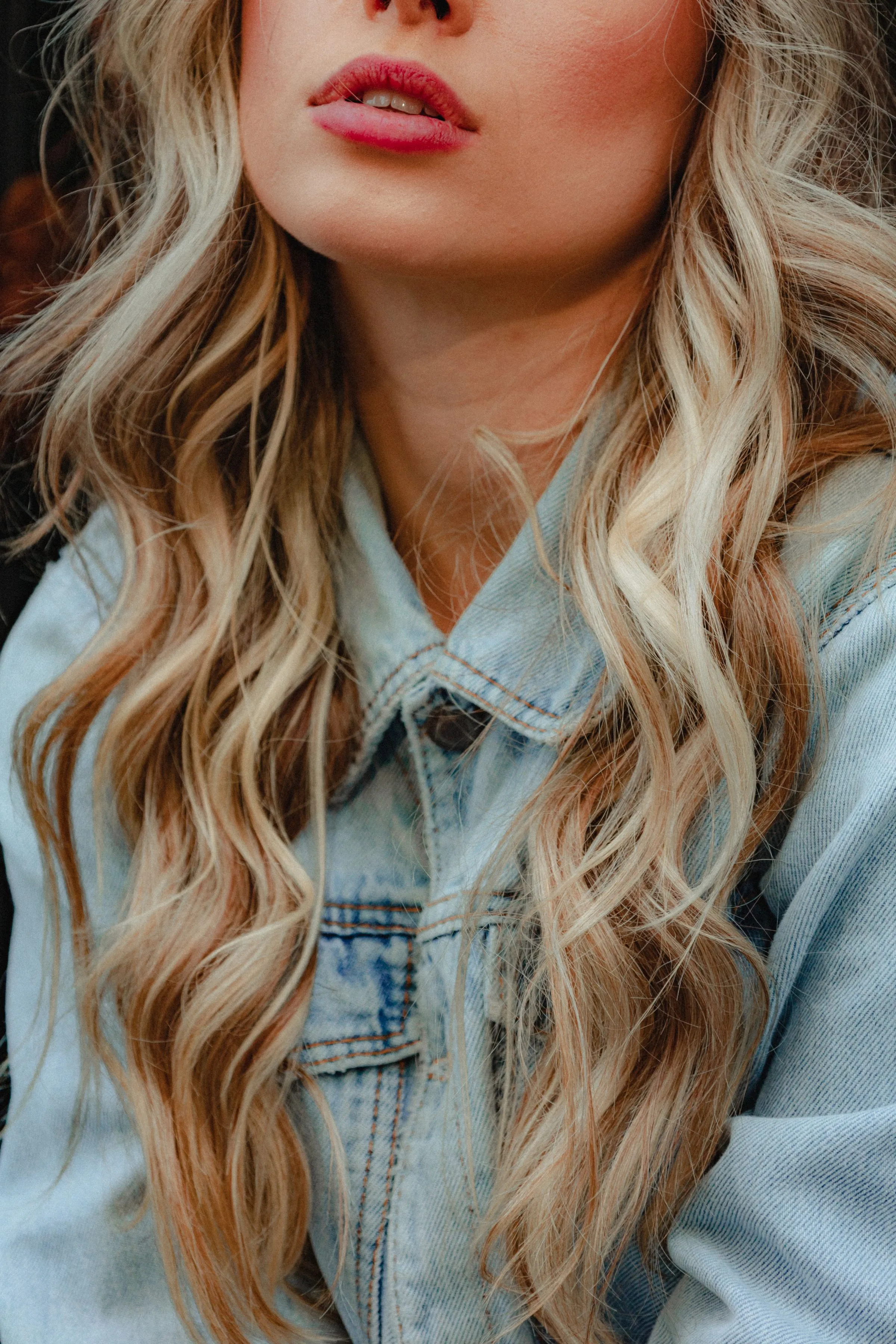 Long blonde balayage waves, close up.