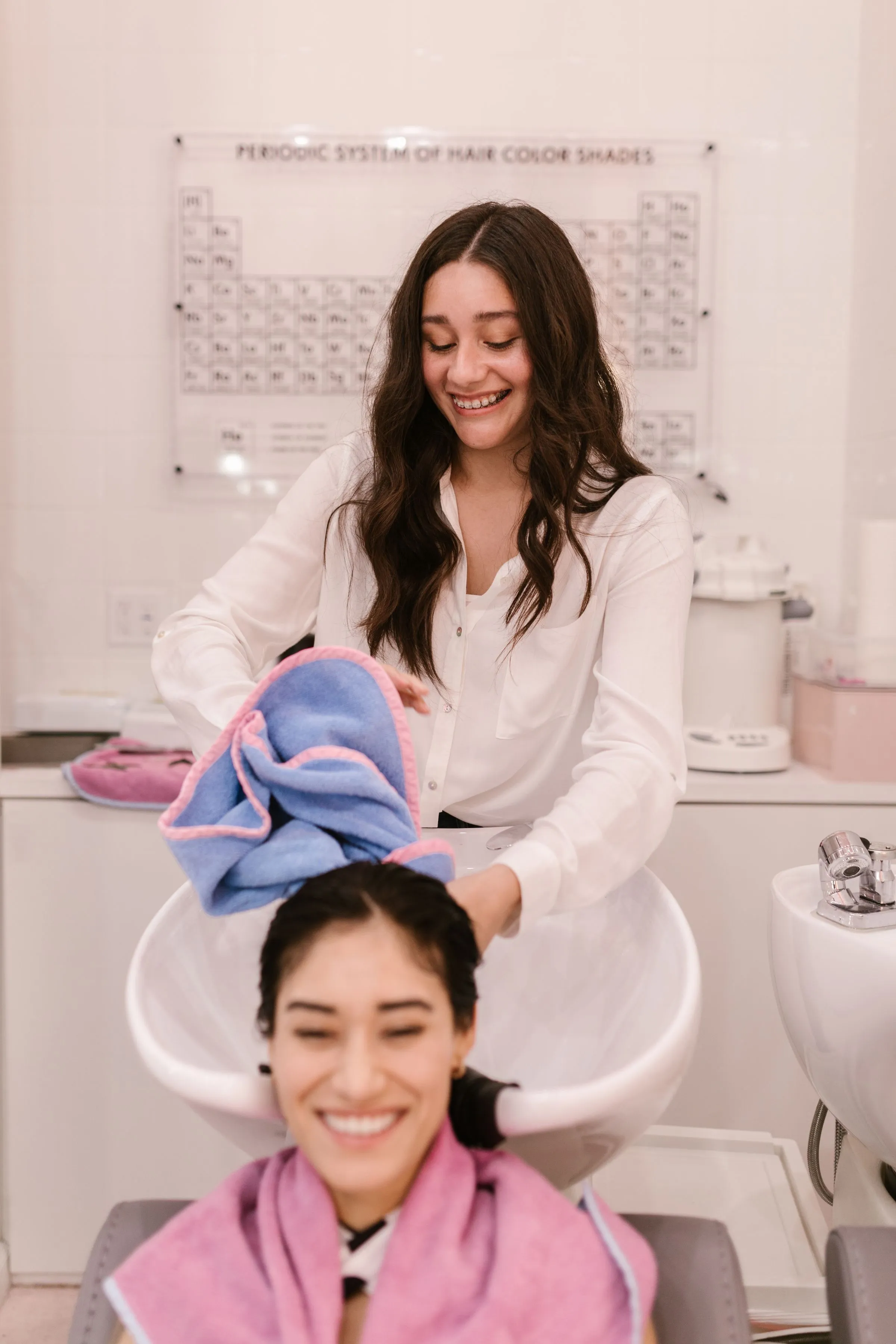 A client laughing at the wash basin.