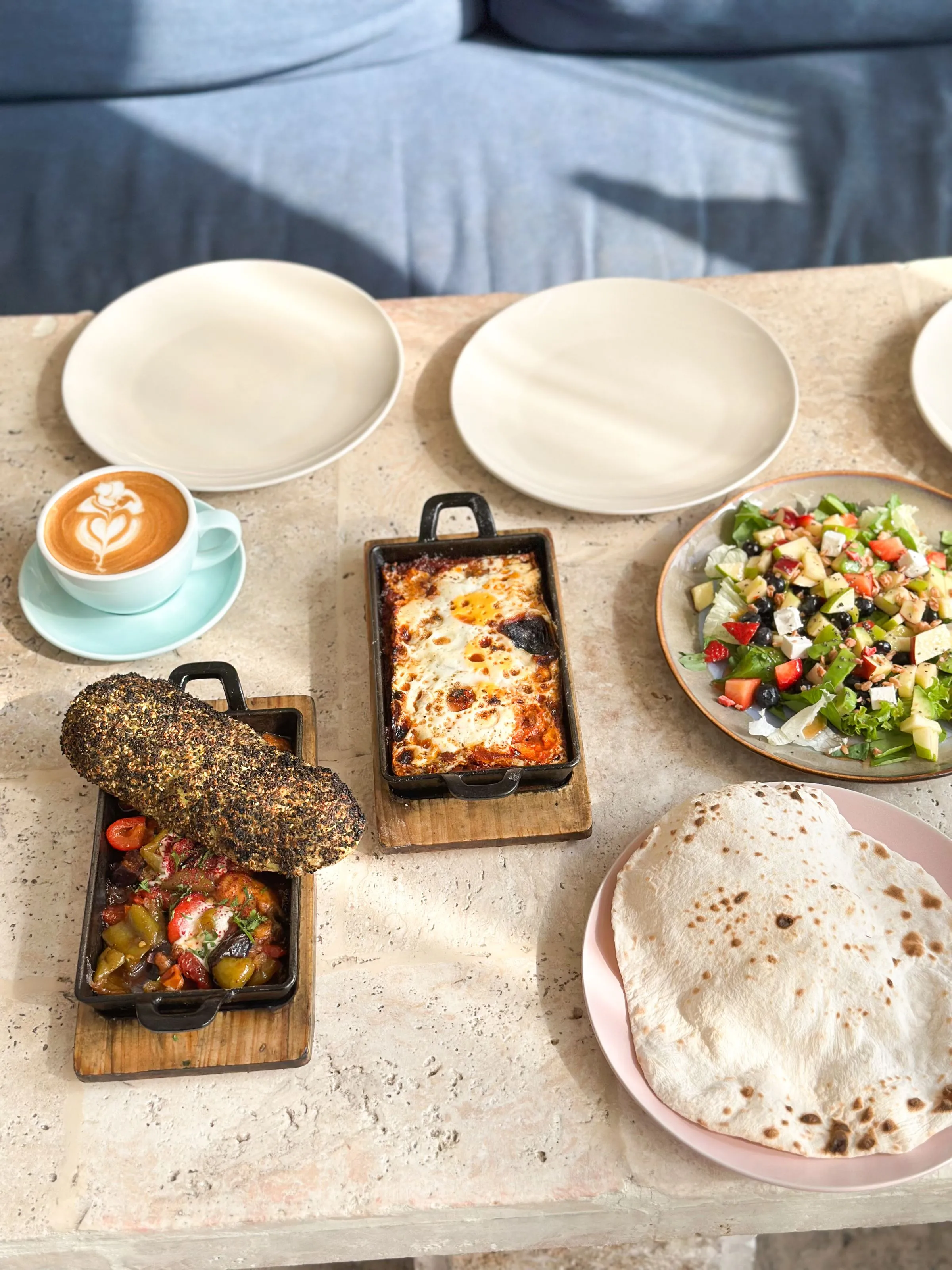 Sunday brunch: baked eggs, salad, bread and coffee.