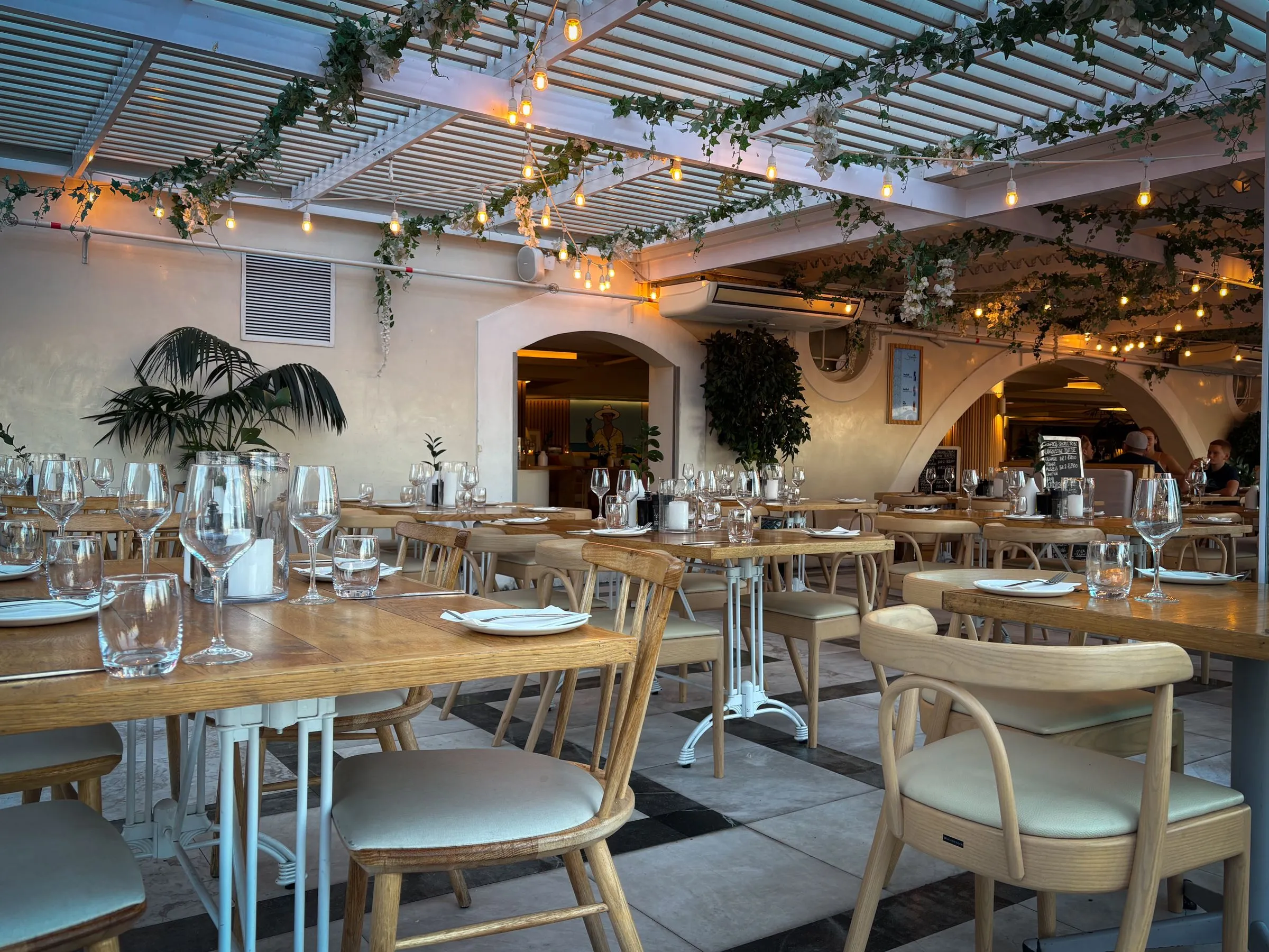 The covered patio with hanging plants.