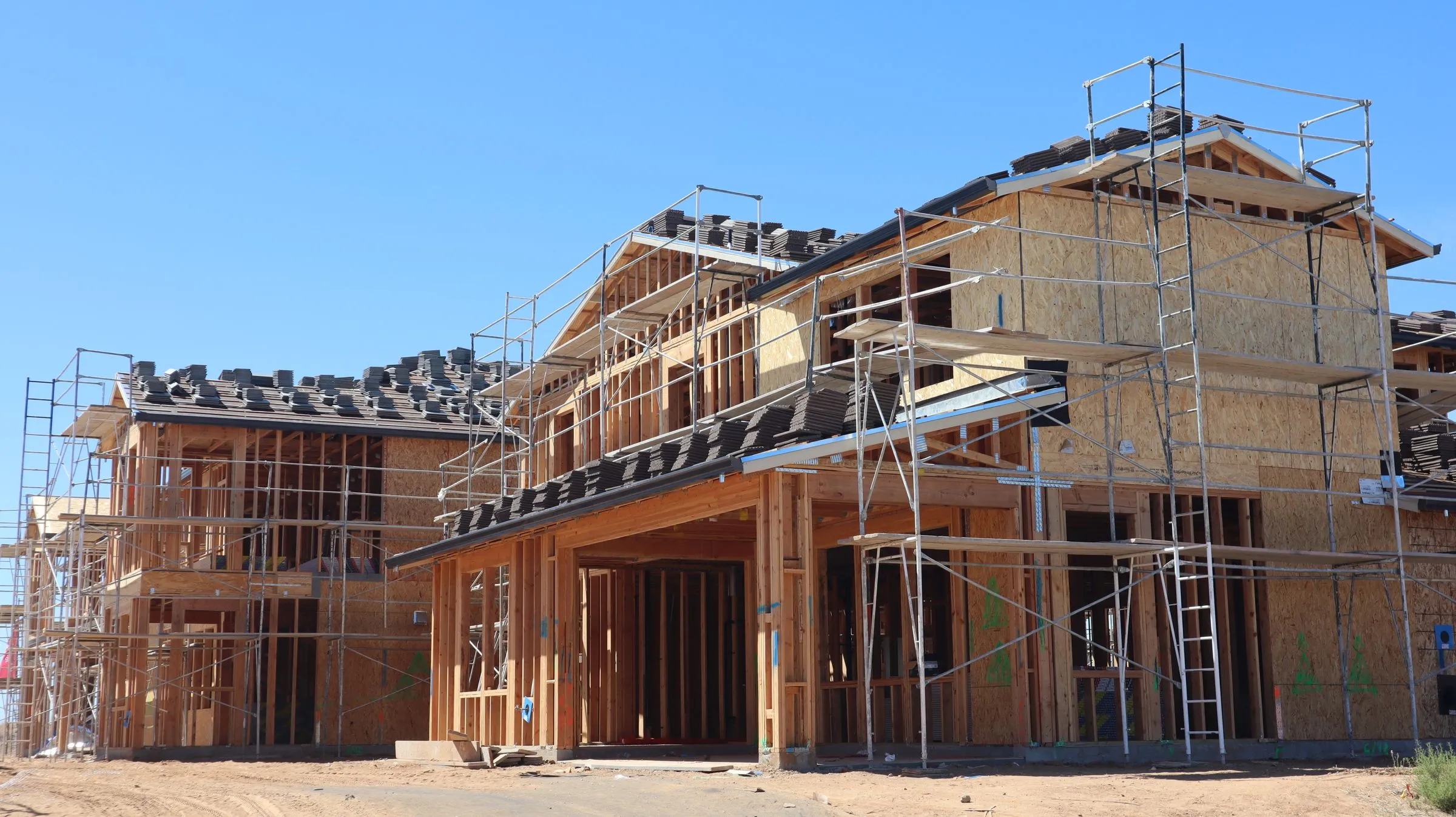 The wood frame of a house going up.