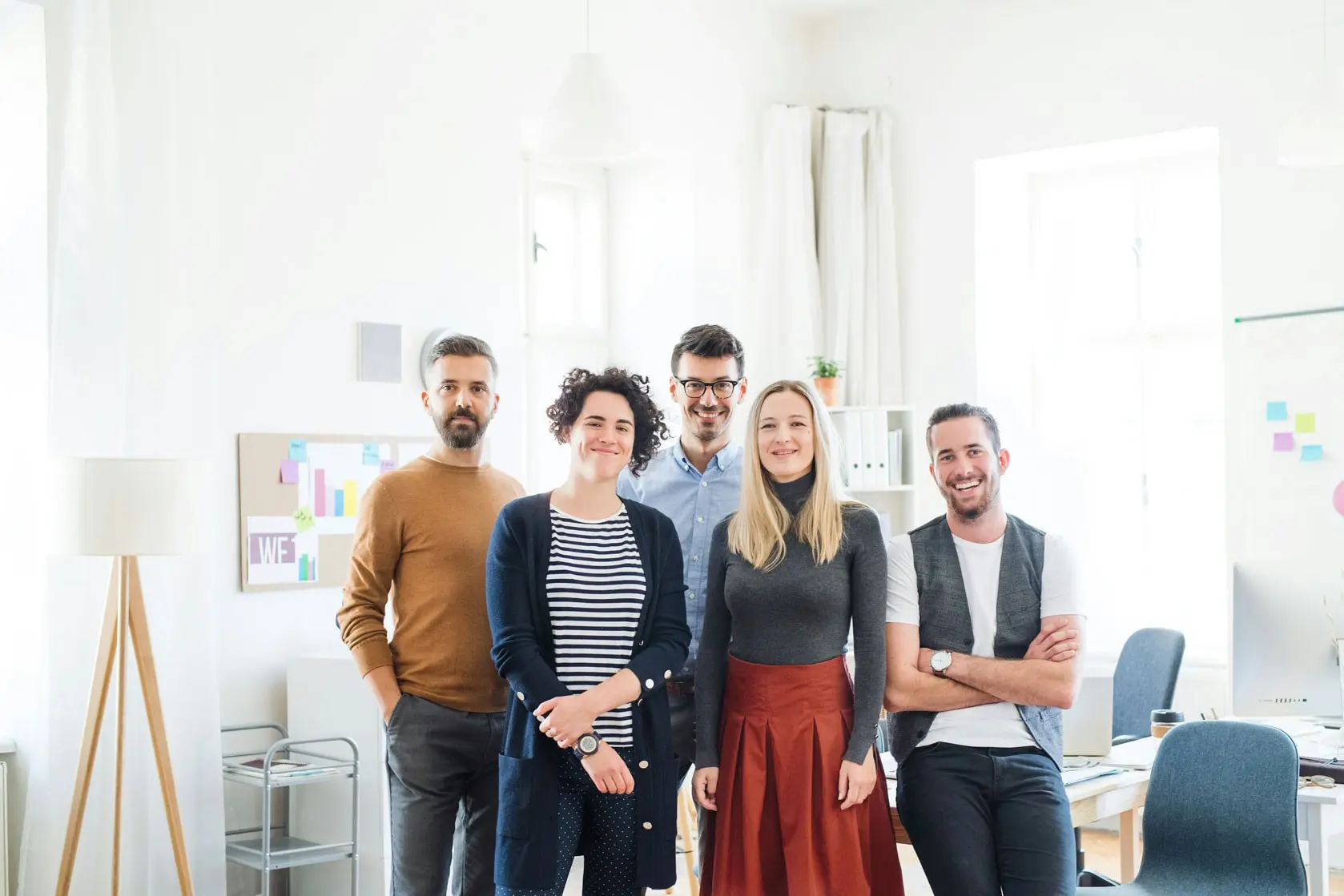 The Quantro CPA team standing together in their bright office