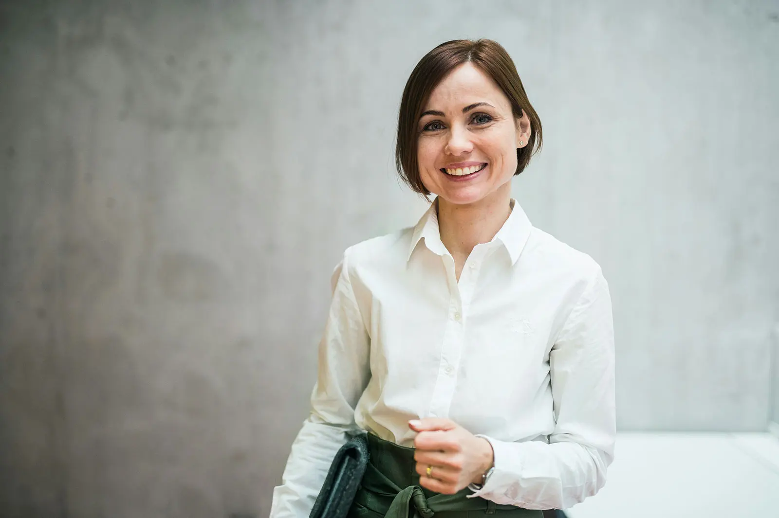 A Quantro advisor smiling in the office hallway
