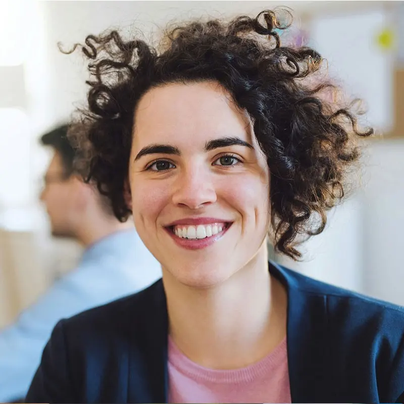 Portrait of Emily Carter smiling in the office